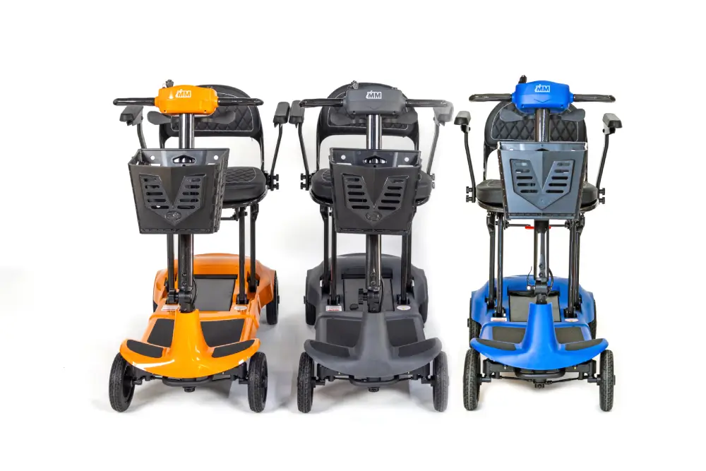 Front view of Monarch Mobility Genie Ultralight folding mobility scooters in orange, grey, and blue.