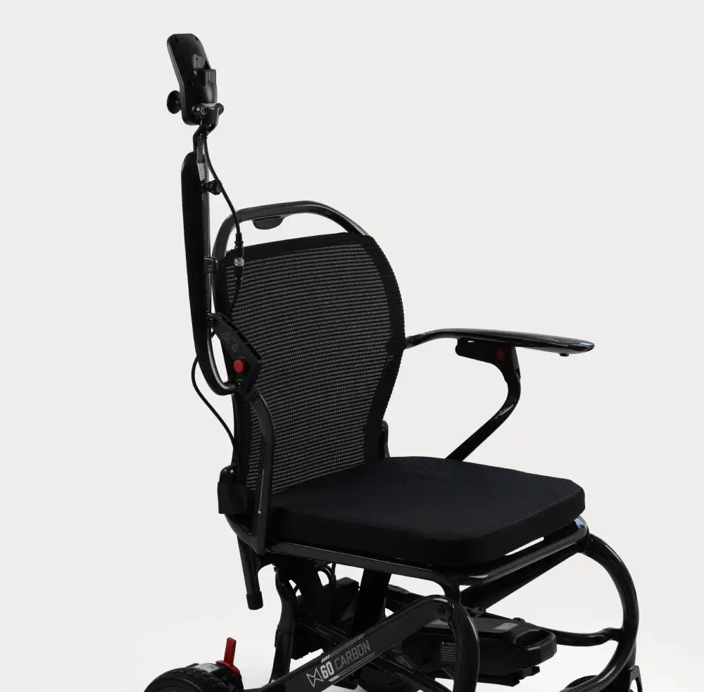Monarch MM60 lightweight electric wheelchair with padded armrests and mesh backrest